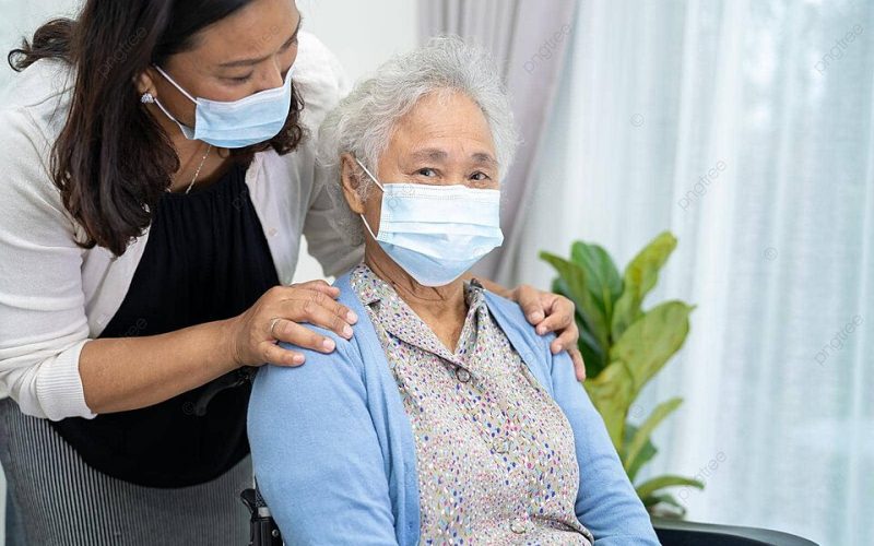 pngtree-asian-senior-with-caregiver-wheelchair-and-face-mask-for-covid19-protection-photo-image_39988034